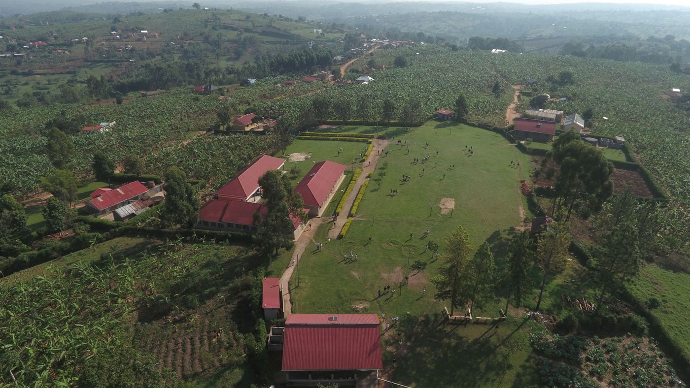 Aerial view of the green Eximius campus and classroom blocks