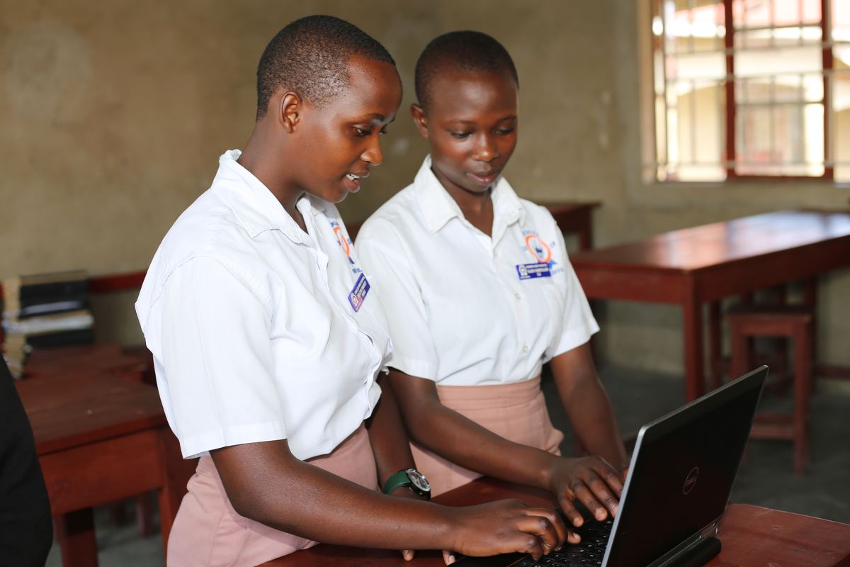Two students using a laptop