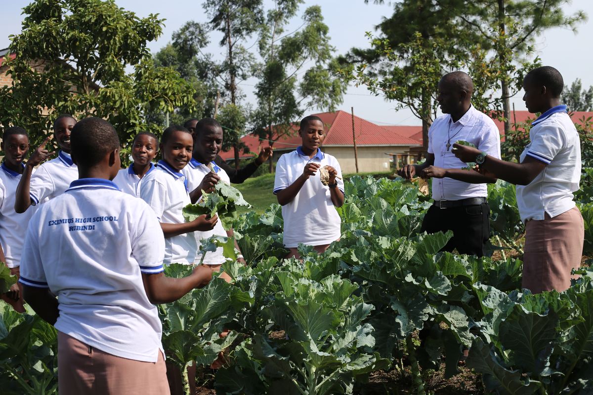 Students learning in the school garden